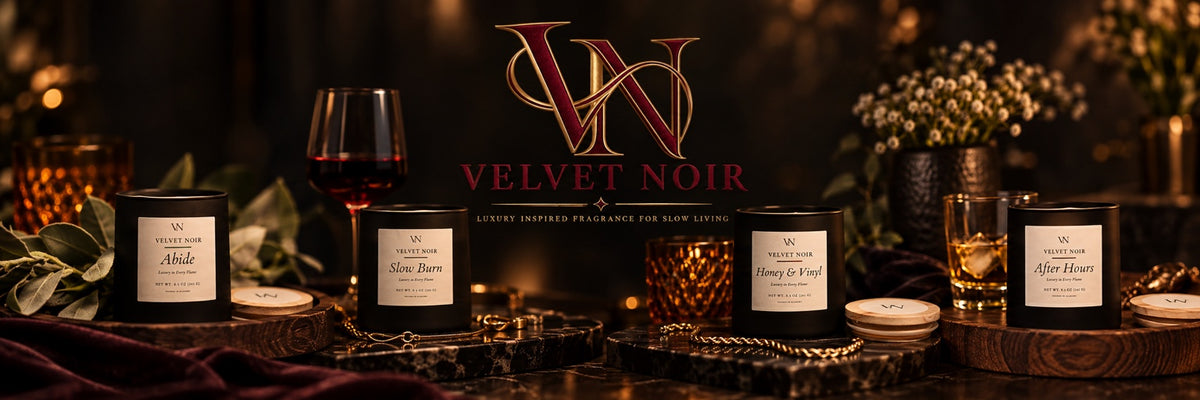 Velvet Noir candle collection in a warm luxury setting