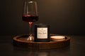 Velvet Noir Slow Burn candle styled with a wine glass